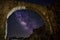 Low angle view of a ruined building under a starry sky at night - perfect for wallpapers