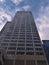 Low angle view of skyscraper Shell Centre (140 m) in Calgary downtown with brand logo on top in the evening light.