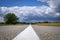 Low angle view of a tarred road receding