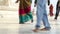 Low angle view of tourists walking down the front patio of Taj Mahal.