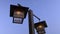 Low-angle view of vintage-looking lamppost under blue sky