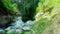 Low angle view through the waterfall edge Kedung Kayang