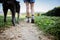 Low angle view of a woman in hiking shoes on footpath