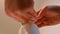 Low angle view of woman using liquid soap dispenser