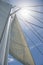 Low angle view of yacht sails and mast against sky