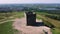 low aspect aerial orbital clip of the historic tower monument of Rivington Pike