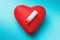 Low battery and heart on a blue background. Poor Health Concept