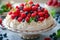 Low-calorie dessert Pavlova with fresh berries.