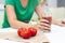 Low calories drink for wellness. woman making homemade drink by extracting fresh tomato juice