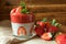 Low Carb Strawberry and chia puddings in a glass, wood background