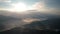 Low clouds and morning mists covered mountain slopes