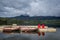 Low clouds at the Pyramid Lake, Jasper National Park dock with boats and red chairs