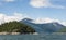 Low clouds surround mountains at lake