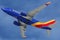 Low cost carrier Southwest airlines Boeing 737-700 in blue sky background