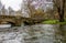 Low down view of a stone bridge over the River Wye in the town of Bakewell