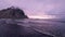 Low Drone Flight Over Ocean in Stokksnes Iceland Epic Purple Sunset Black Sand Beach