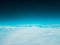 Low earth orbit above the horizon turquoise green space and white clouds