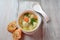 Low fat vegetable soup with chicken meatballs, potato and carrot and fresh herbs in bowl