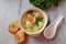 Low fat vegetable soup with chicken meatballs, potato and carrot and fresh herbs in bowl