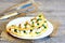 Low fat vegetarian tofu omelette. Delicious fried omelette stuffed with tofu and fresh parsley on a plate, fork and knife