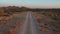 Low flight of a drone following a dirt road