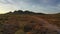 Low flight of a drone following a dirt road