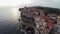 Low flight over old city Bonifacio at sunset colors. Corsica, France. Aerial view.