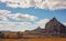 Low grass growing on African savanna, small rocky mountains in background - typical prehistoric like scenery at Isalo national