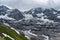 Low-hanging clouds above Eiger Gletscher and eternal snow in the Alps