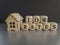 Low house rates symbol. Concept words \\\'Low rates\\\' on wooden cubes near miniature houses