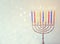 Low key image of jewish holiday Hanukkah background with menorah Burning candles over glitter background