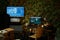 Low key shot of workplace of military officer with two computer screens