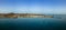 Low level aerial panoramic view of Corralejo harbour, town and beaches