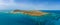 Low level panoramic aerial image of Lobos island and sheltered bay looking very tropical in the sunshine, near Corralejo