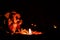 Low light photography of beautiful earthen lamp and ganesha statue against dark background with copy space. religious and faith