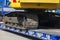 Low loader trailer with crawler excavator, close-up