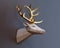 Low poly deer trophy golden horns in profile