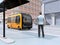 Low polygon style man waiting self-driving shuttle bus at bus stop