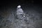 Low pyramid latza made of stones of different sizes and textures in depths of  dark cave,  adit.  key point of  cavers` route,