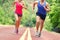 Low Section Of Determined Couple Running On Road