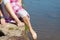 Low Section Of Girl Dipping Foot In Water