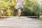 Low section of girl running on pier at lakeshore