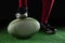 Low section of person stepping on rugby ball