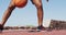 Low section of senior african american man playing basketball on the court near the beach