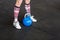 Low Section Of Woman With Blue Kettlebell