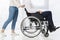 low section woman pushing man sitting wheelchair. High quality beautiful photo concept