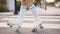 low section woman wearing vintage roller skate walking road. High quality photo