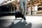 Low Section of Young Businessman Walking in the Modern Transport Terminal. Walk into the Camera. Lifestyle of Modern Traveler. Low