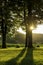 Low setting sun in green park casting long shadows. Chapel of Gods mother by the Veveri castle Brno Czech Republic