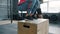 Low shot of sportswoman jumping onto wooden box during crossfit training with coach